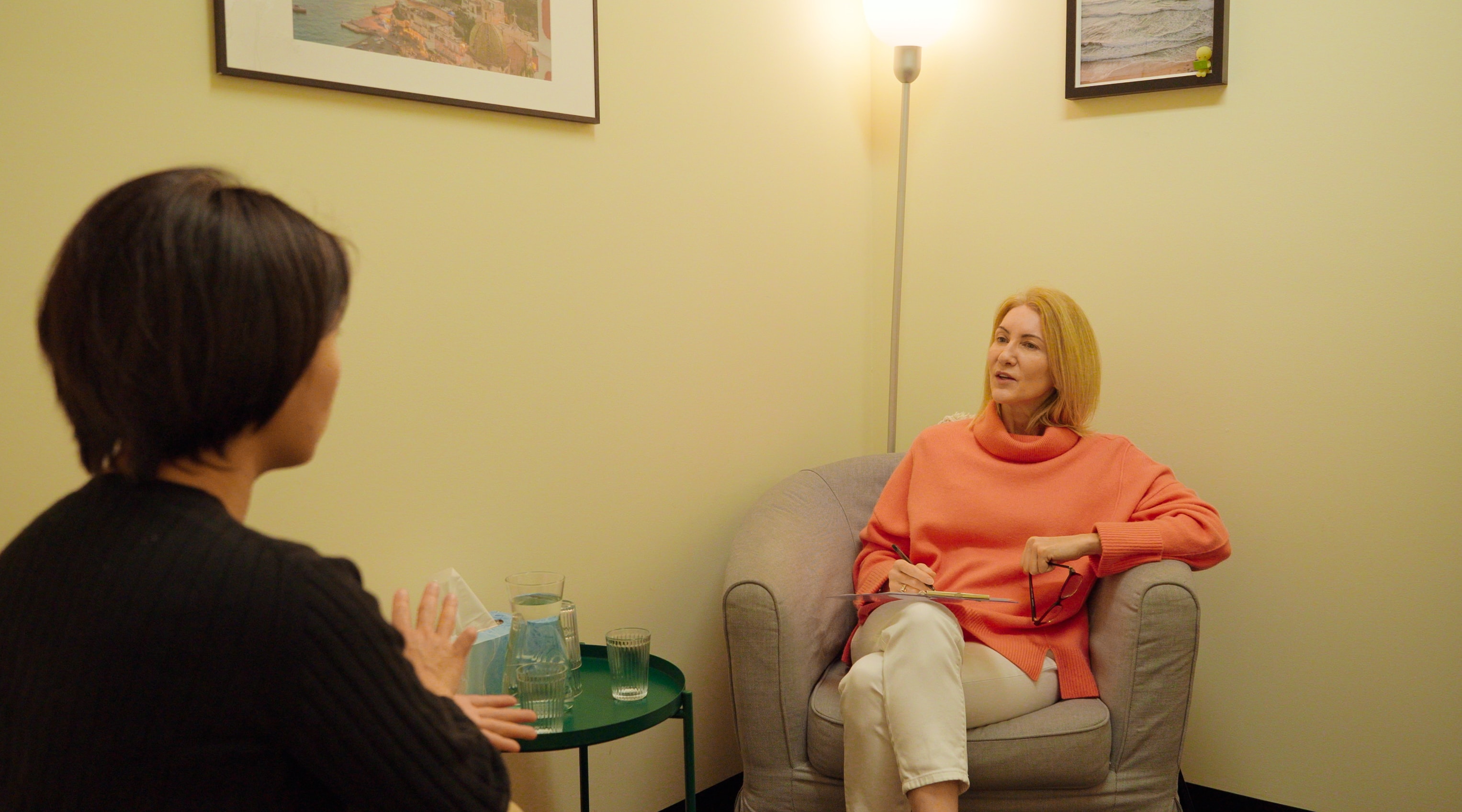 Psychologist and client in a warm therapy session